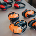 Ear protecting headphones on a table at an adaptive concert